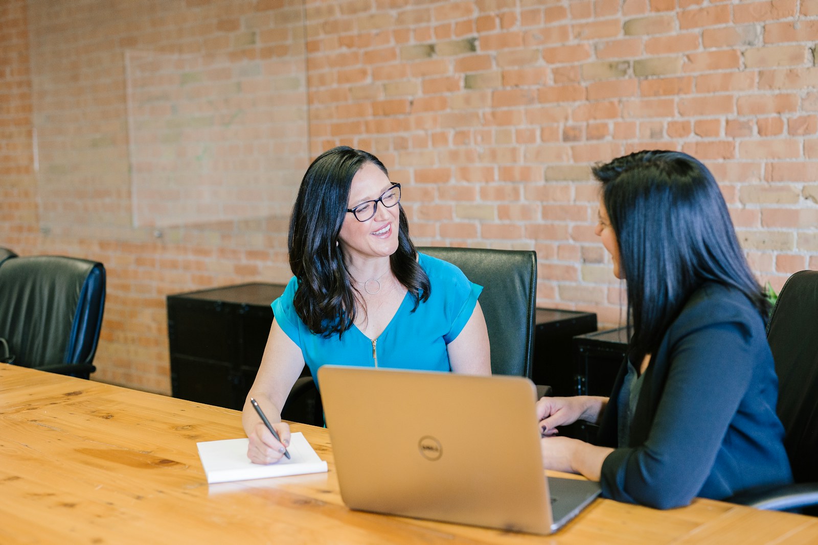 Two professionals discussing a sourcing request